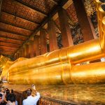 Gold buddha with a orange background